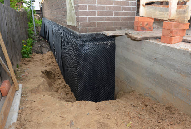 Happy homeowners after waterproofing job in Centre